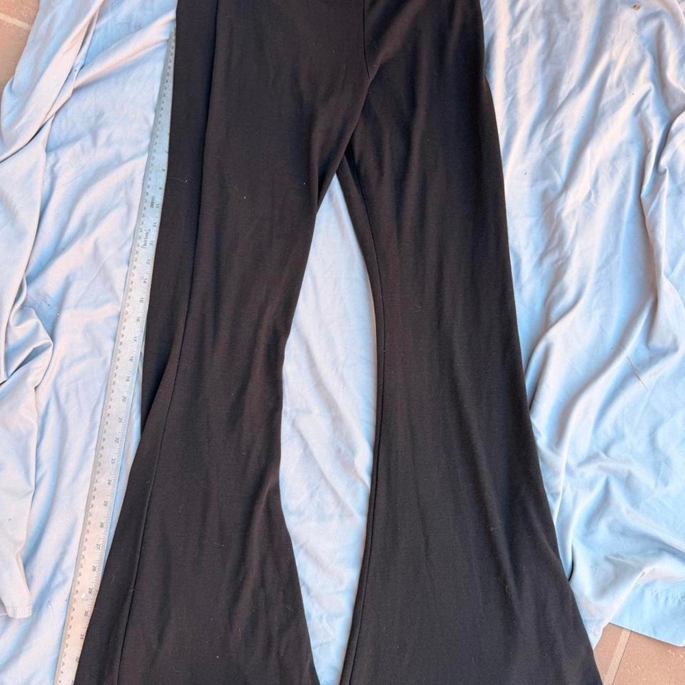Black flare pants with ruffle hem